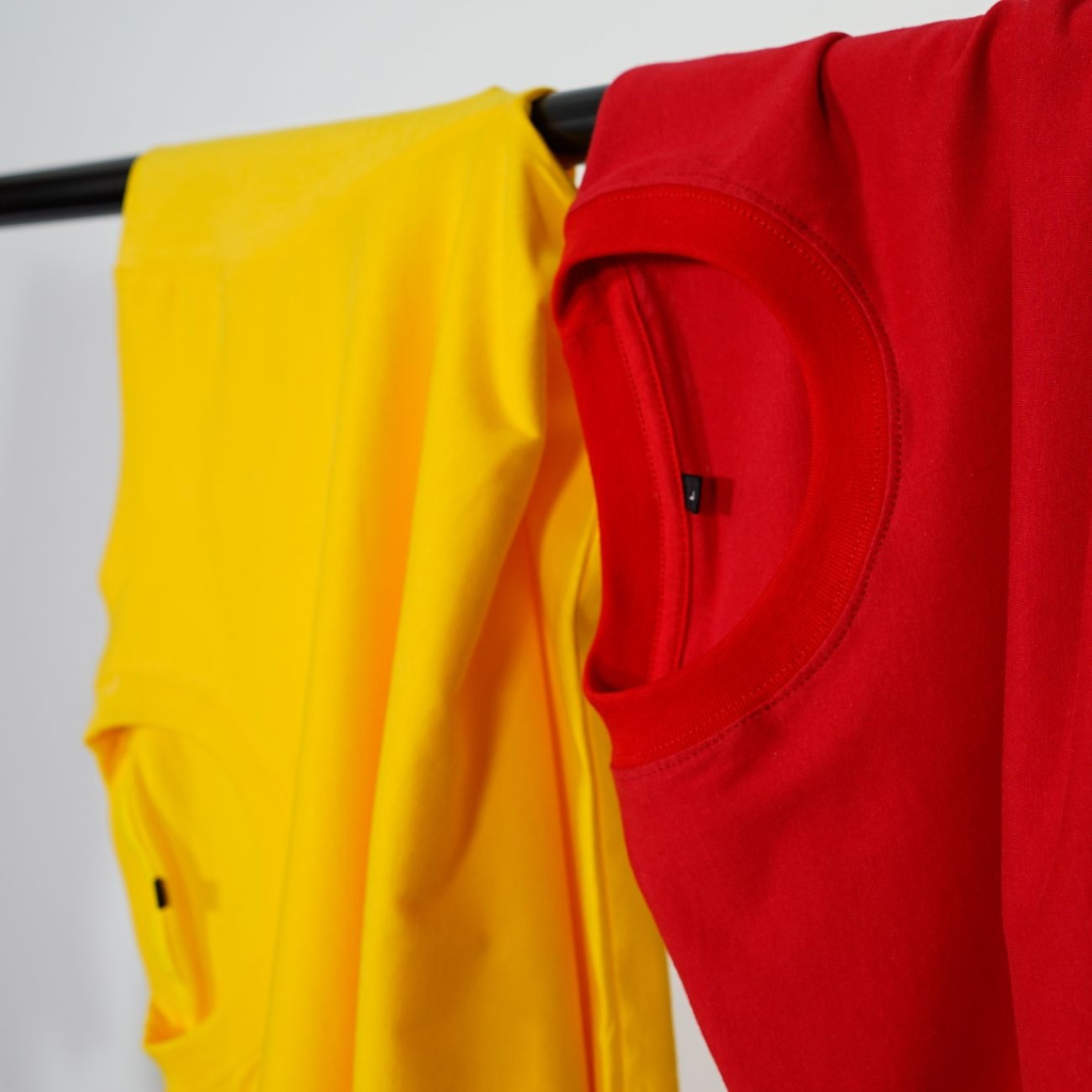 Folded team apparel sorted by size for an order